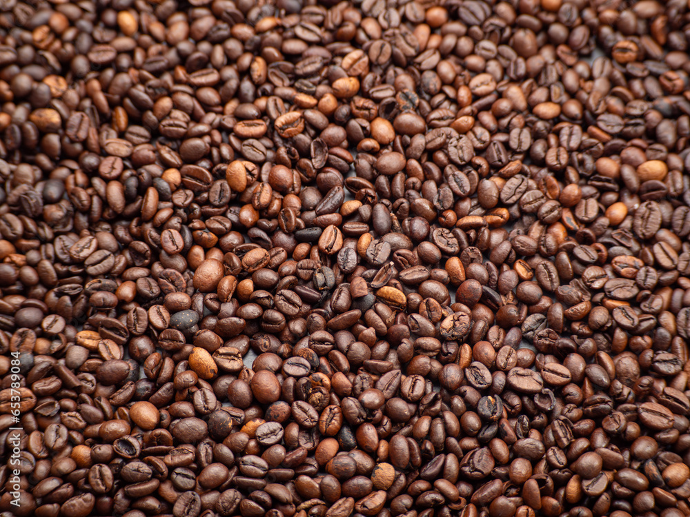 Close-up of roasted coffee beans. Background from Coffee beans. Close-up of roasted coffee beans. Background from Coffee beans.