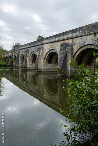 Pont du Vernay, 12th century ancient bridge over the river Thouet at Airvault, Deux-Sèvres, Nouvelle-Aquitaine, France photo