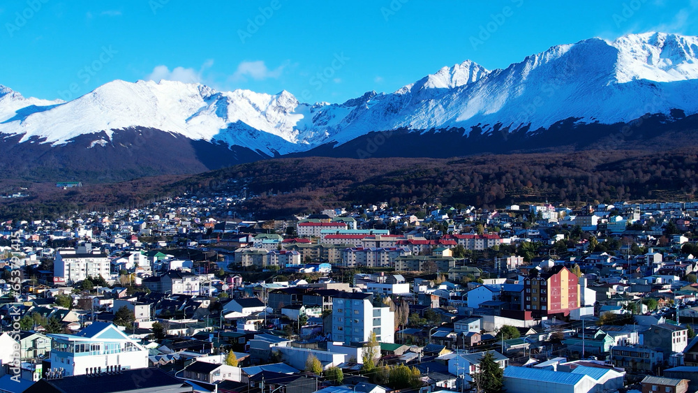 Downtown Ushuaia Argentina at Tierra del Fuego. Natural landscape of scenic town between mountains. Ushuaia Argentina. Patagonia Argentina at Ushuaia Tierra del Fuego Argentina. Downtown city. - obrazy, fototapety, plakaty 