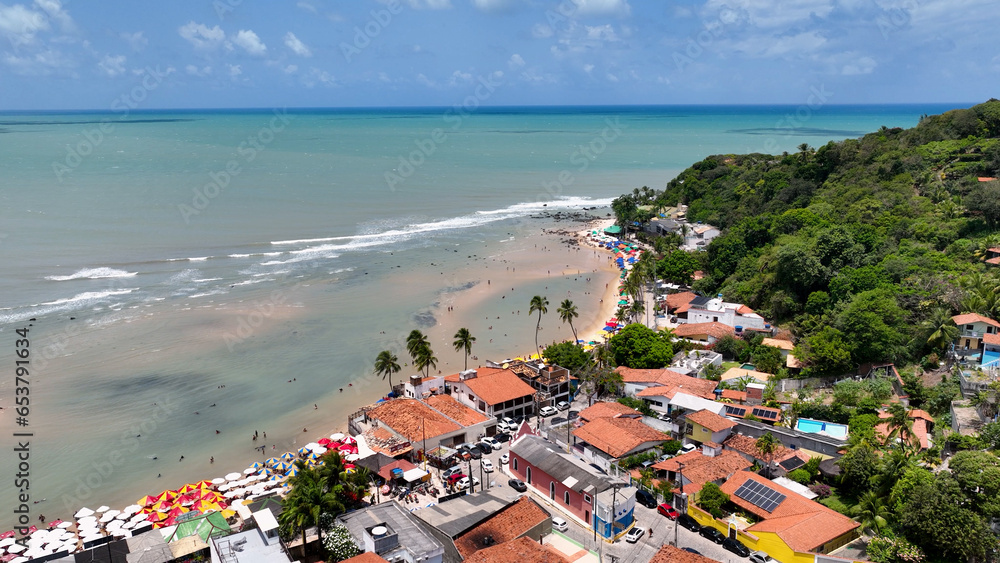 Naklejka premium Scenic cliffs at Pipa Beach in Rio Grande do Norte. Brazil Northeast. Vacations landscape. Paradise scenery. Pipa Beach at Rio Grande do Norte. Scenic cliffs on the beach. Brazil Northeast.