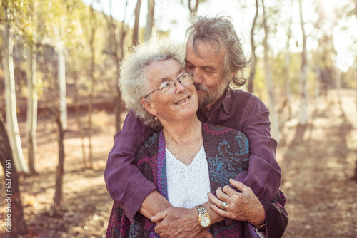 Happy elderly couple hug in the Northern Territory photo