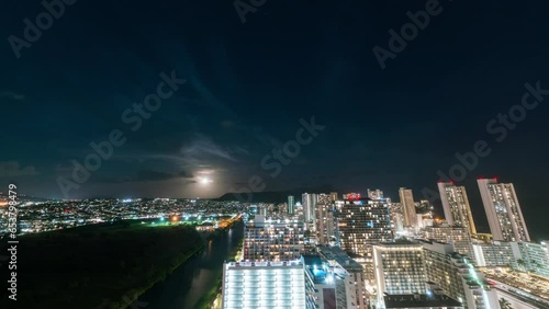 Timelapse of moonrise over Waikiki city lights in Oahu Island, Hawaii, USA