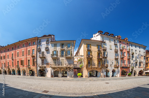 Cuneo, Piedmont, Italy - August 16, 2023: Cityscape on Roma Street main pedestrian cobblestone street with Ancient buildings decorated and with arcade in historic center, fisheye vision photo