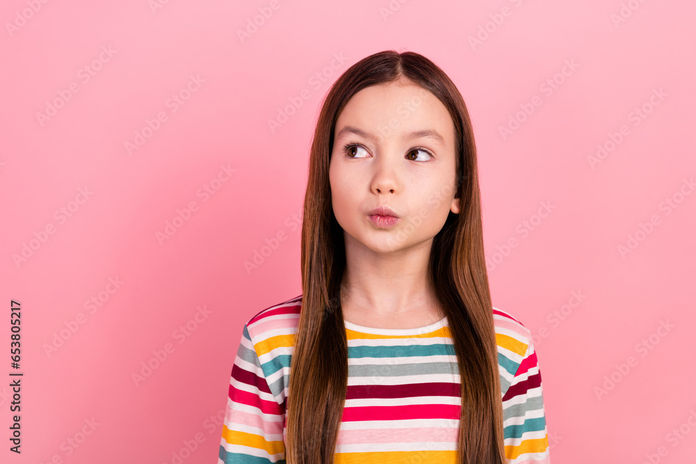 Photo of charming face small girl kid pouty lips comic humorous looking empty space thoughtful dreamy isolated on pink color background - obrazy, fototapety, plakaty 