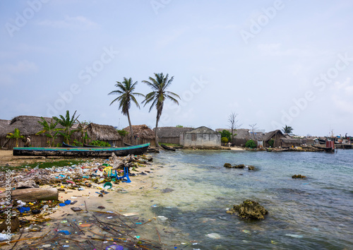 Panama, San Blas Islands, Mamitupu, Pollution On The Banks Of A Kuna Indian Village photo