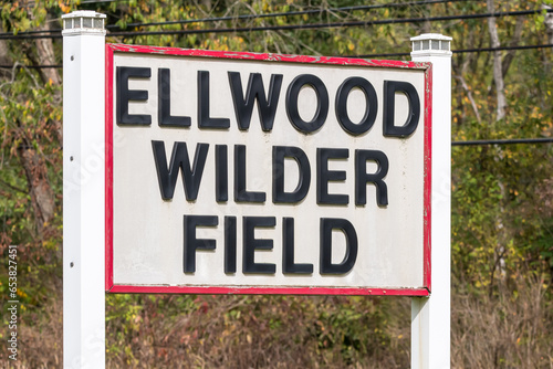 The sign for the Ellwood Wilder Field, a baseball field in Youngsvile, Pennsylvania, USA on a sunny fall day photo