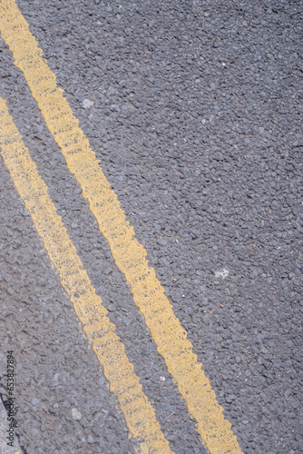 Wallpaper Mural Asphalt road with yellow line texture background, closeup of photo Torontodigital.ca