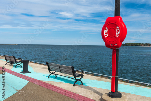 Fotografie Two wooden benches on the Dunkirk, New York, USA city pier on Lake Erie along wi