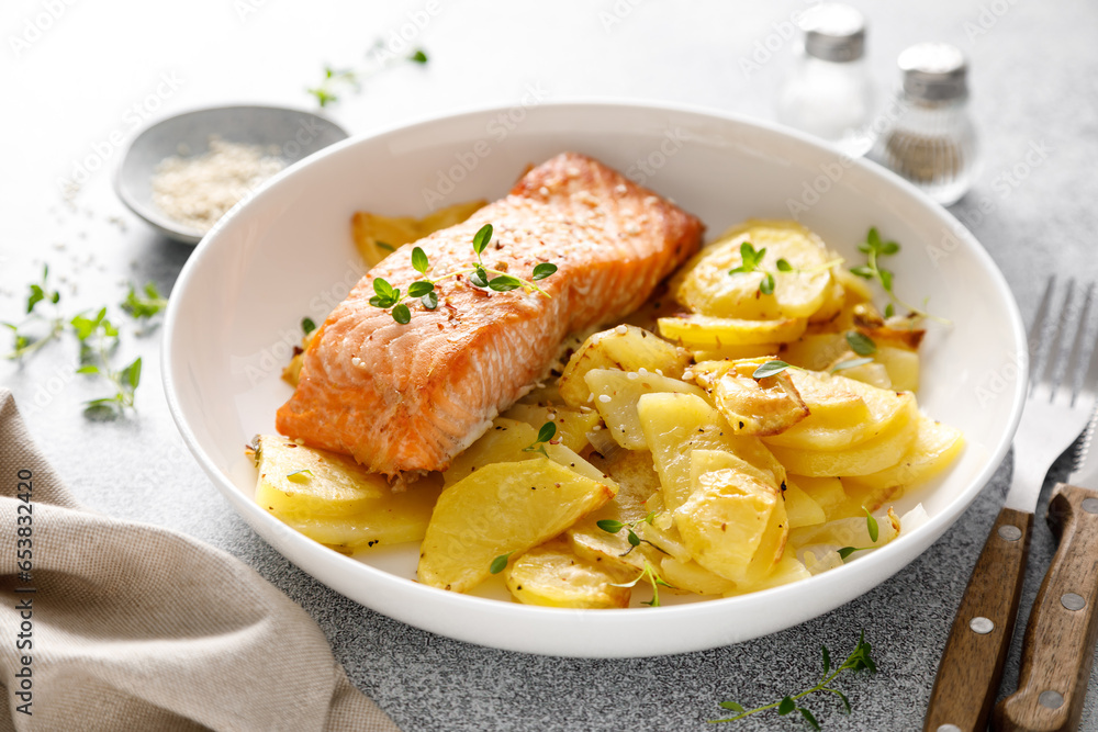 Salmon grilled and baked potato with onions