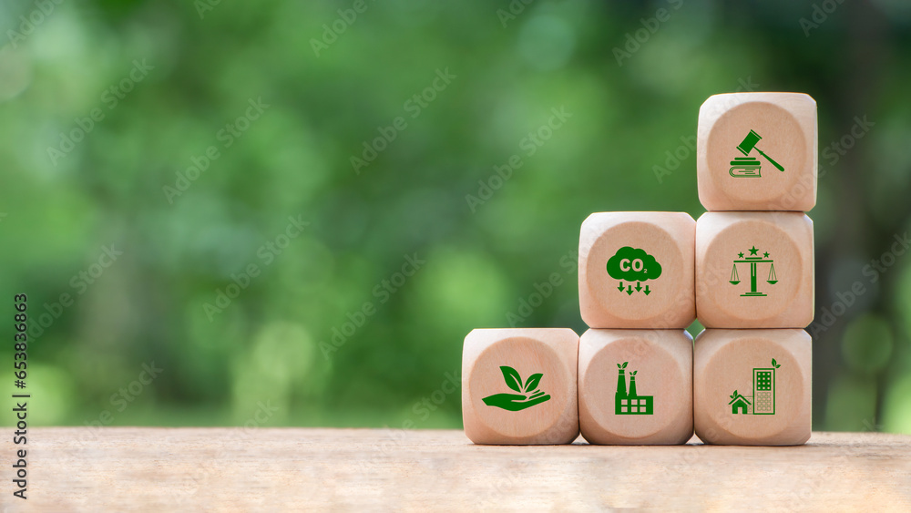 Wooden block with environmental law icons. Concept of international law environmental protection, environmental impact assessment, Eco friendly law, eco balance, business corporate and industry. - obrazy, fototapety, plakaty 