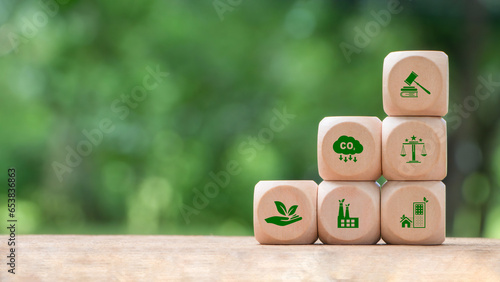 Wooden block with environmental law icons. Concept of international law environmental protection, environmental impact assessment, Eco friendly law, eco balance, business corporate and industry.