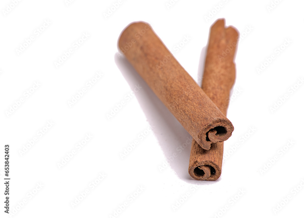 pair of cinnamon sticks next to each other (on top, cut out) isolated on white background (spices, spice, ingredient, flavoring, pie, dessert) indian cooking, spice islands