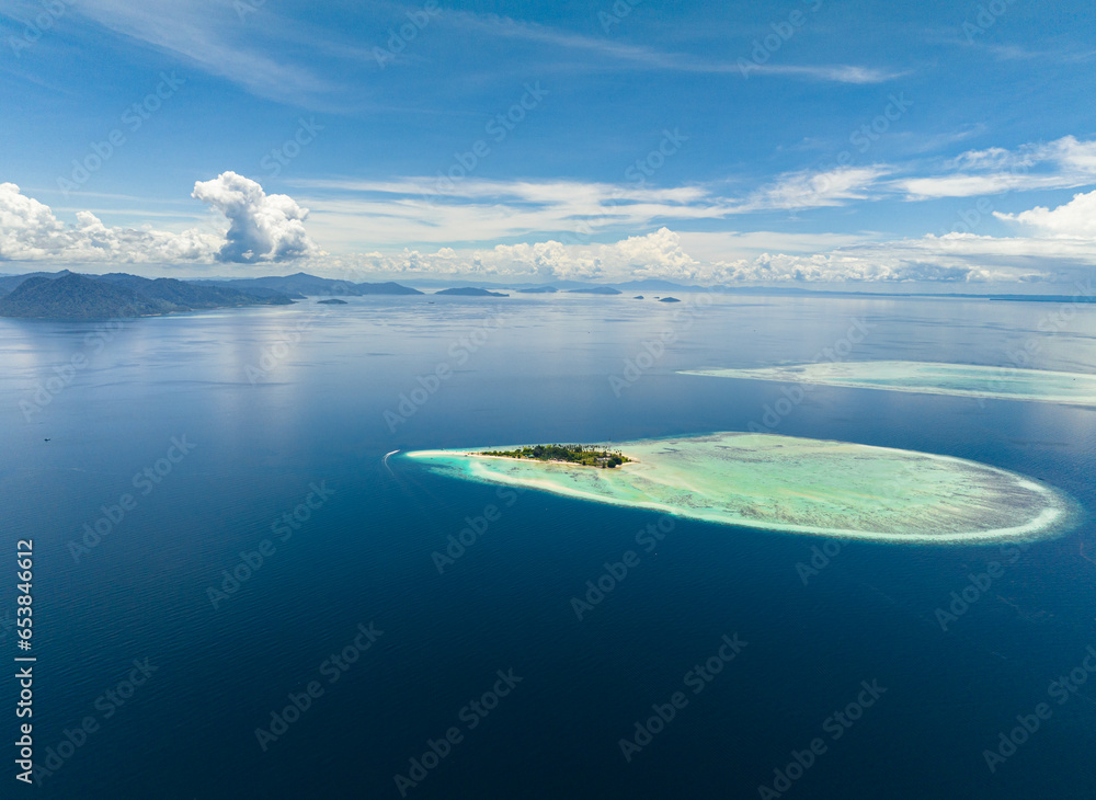 Aerial view of tropical island and coral atolls in tropic. Tun Sakaran Marine Park. Borneo, Sabah, Malaysia.