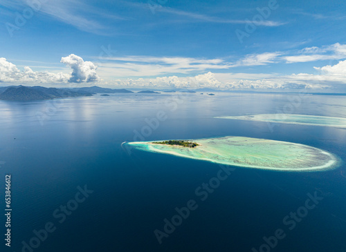 Fototapeta Naklejka Na Ścianę i Meble -  Aerial view of tropical island and coral atolls in tropic. Tun Sakaran Marine Park. Borneo, Sabah, Malaysia.