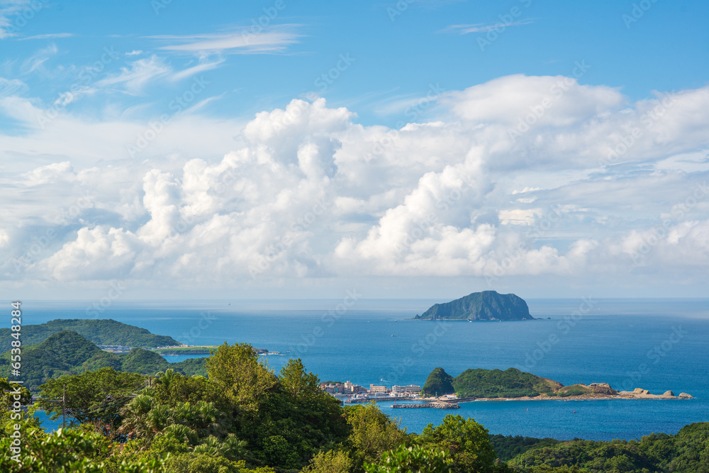 The blue sea, the blue sky, and the dynamic white clouds. View of Keelung Island from Jiufen, New Taipei City, Taiwan.