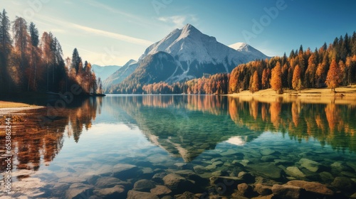Amazing autumn view of lake with peak on background Calm morning view . Beauty of nature concept background.