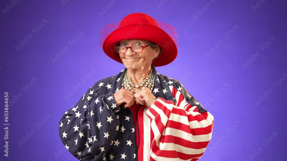 Confident senior elderly woman 80s wears American flag jacket pointing fingers on herself showing thumb up like gesture motivating encourage isolated on purple background in studio Confident senior elderly woman 80s wears American flag jacket pointing fingers on herself showing thumb up like gesture motivating encourage isolated on purple background in studio