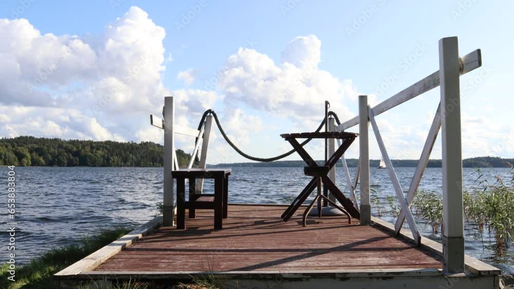 Landscape view at a lake. Outside furniture at a bridge. Stockholm, Sweden, Scandinavia, Europe. Landscape view at a lake. Outside furniture at a bridge. Stockholm, Sweden, Scandinavia, Europe.