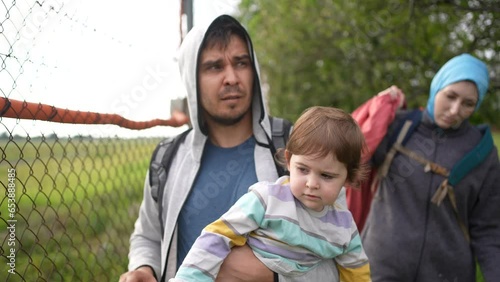 portrait refugee family runs Illegal Border crosser problem undocumented person photo