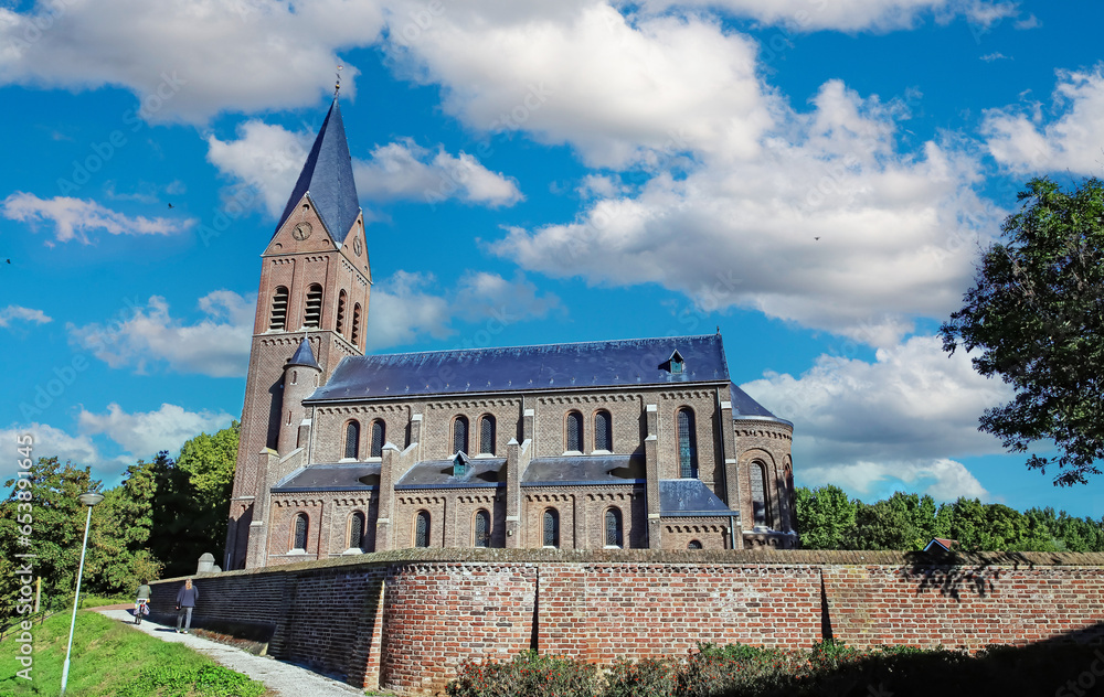 Ancient dutch church in rural village in summer - Linne (St. Martinus Kerk), Limburg, Netherlands