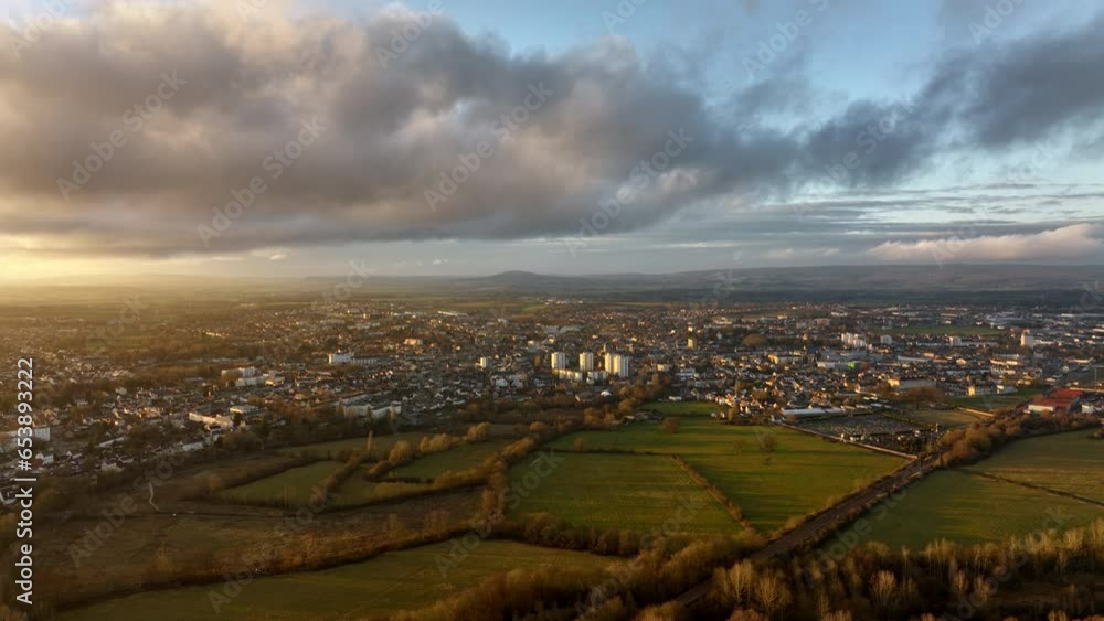 Aerial panorama of Alençon, France, showcasing the expansive cityscape against a backdrop of dramatic clouds. Aerial panorama of Alençon, France, showcasing the expansive cityscape against a backdrop of dramatic clouds.