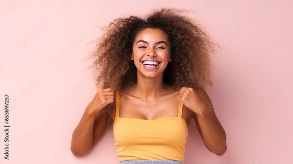 Young fitness caucasian woman isolated laughs happily and has fun keeping hands on stomach. Young fitness caucasian woman isolated laughs happily and has fun keeping hands on stomach.