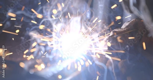 Welding of metal structures with sparks flying in the air. photo