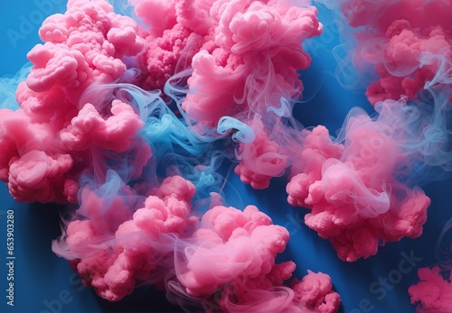 Puffs of pink smoke in front of a blue background 