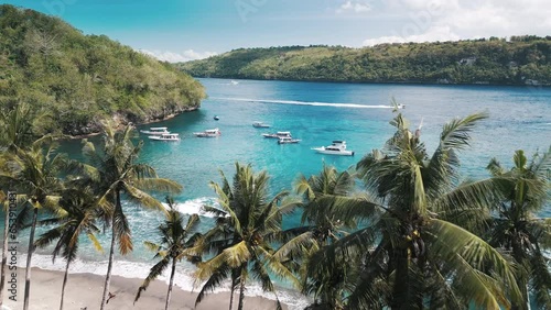 Tropical lagoon with turquoise water and palm trees. Gamat Bay on the Nusa Panida island. Bali, Indonesia photo