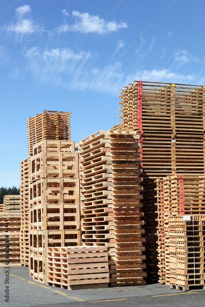 Stacked wooden pallets or skids Stacked wooden pallets or skids