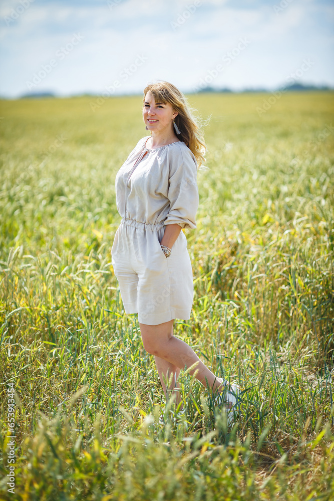 beautiful girl in a linen dress in a wheat field beautiful girl in a linen dress in a wheat field
