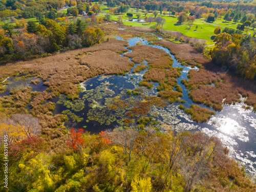 Pine Brook marsh aerial view in fall with fall foliage in town center of Wayland, Massachusetts MA, USA.  photo