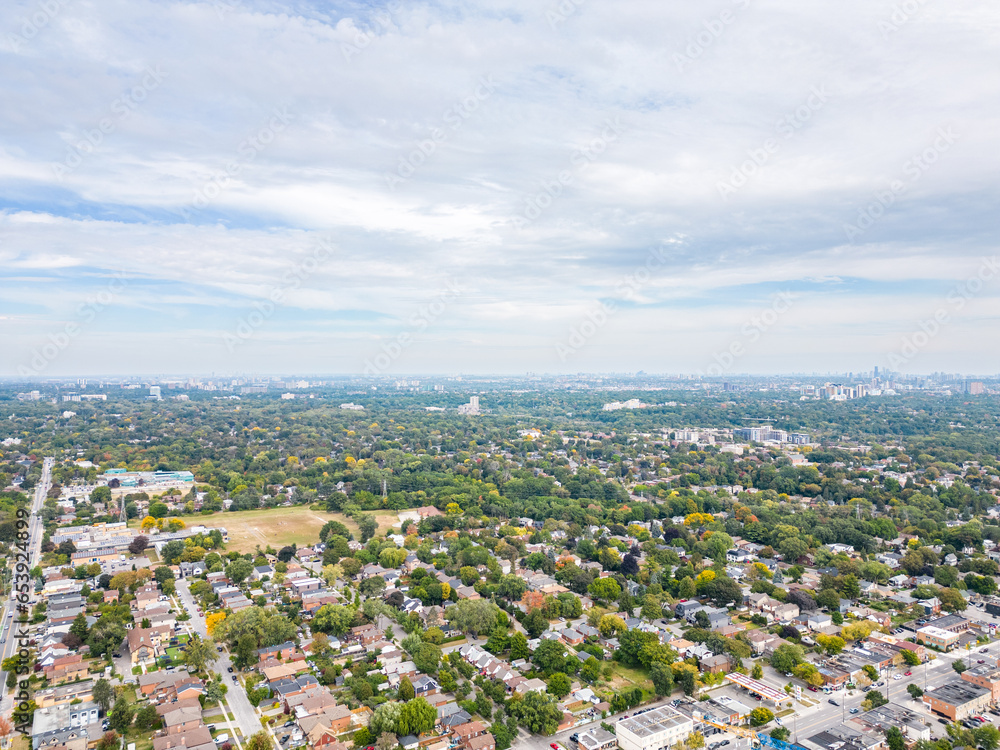 Explore the breathtaking cityscape of downtown Toronto and South Etobicoke captured through stunning drone photos in the vibrant colors of the fall season. Immerse yourself in the beauty.