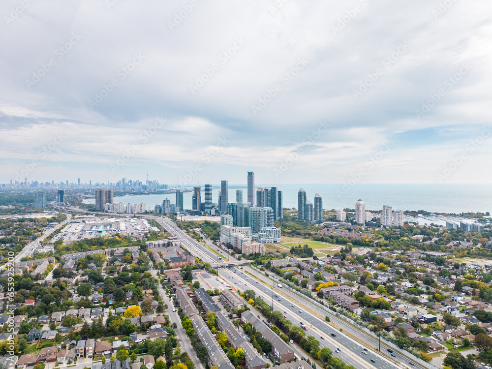 Explore the breathtaking cityscape of downtown Toronto and South Etobicoke captured through stunning drone photos in the vibrant colors of the fall season. Immerse yourself in the beauty.