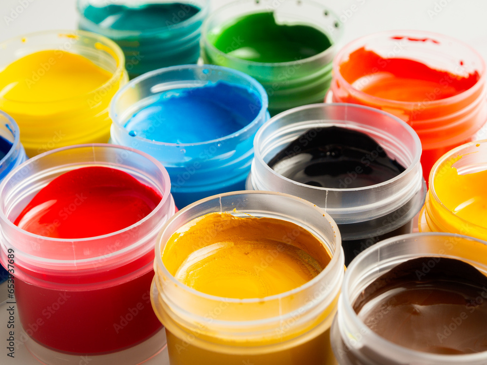Jars of acrylic gouache paint art painting creativity and development close-up Jars of acrylic gouache paint art painting creativity and development close-up
