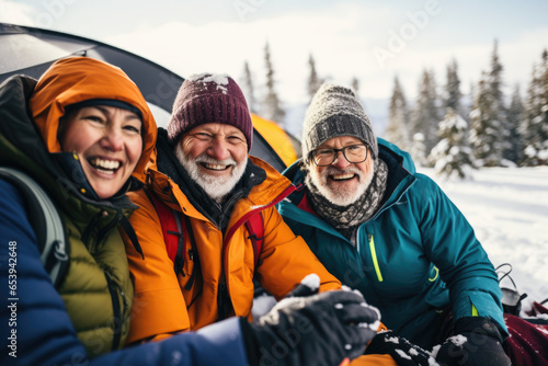 Portrait of group of friends having fun in winter camping.