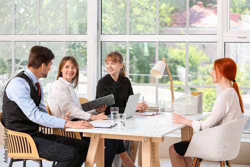 Human resources commission interviewing female applicant in office