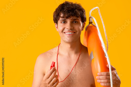 Male lifeguard with whistle...