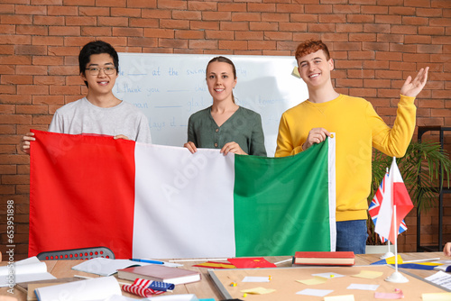 Young students with Italian flag at language school photo