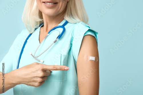 Mature female doctor with m...
