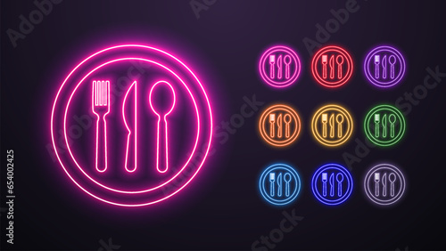 A set of neon icons of a spoon, knife and fork in a round plate in the colors blue, yellow, orange, green, purple, pink, white and red on a dark background. A concept for cafes and food.