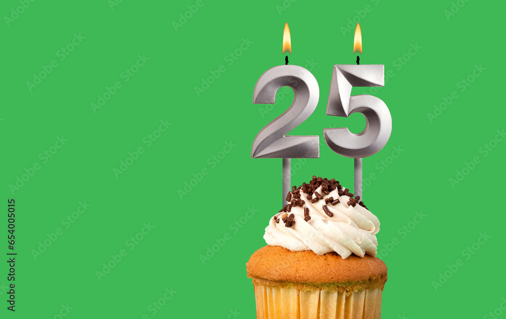 Birthday with number 25 candle and cupcake - Anniversary card on green color background Birthday with number 25 candle and cupcake - Anniversary card on green color background