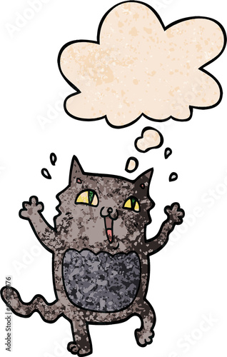 cartoon crazy excited cat with thought bubble in grunge texture style