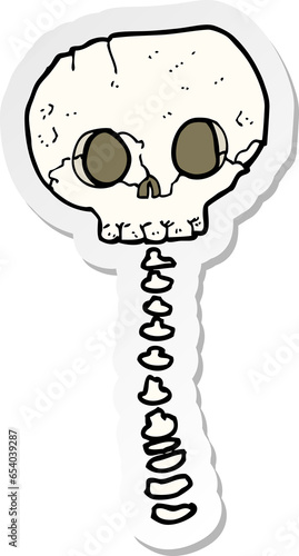 sticker of a cartoon spooky skull and spine