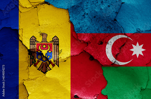 flags of Moldova and Azerbaijan painted on cracked wall