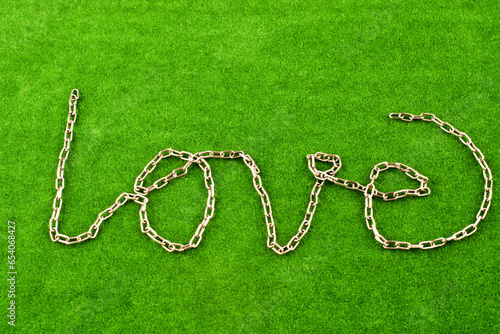 Chain form the word LOVE on grass