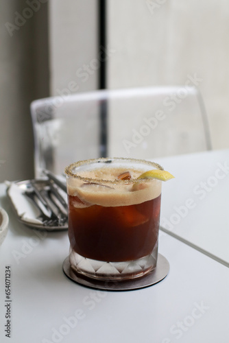 Ice coffee Espresso Tonic soda water with lime juice with sliced lemon on white table. Cold brew. Summer drinks. Homemade Refreshing Beverage.