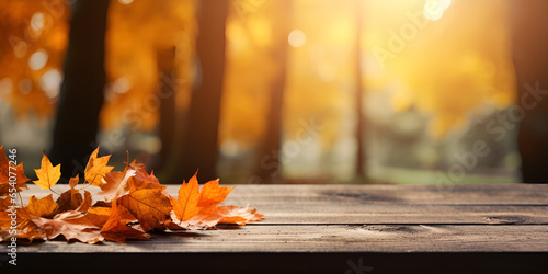 Autumn maple leaves on wooden table.Falling leaves natural background Autumn background with sunset background and trees with autumn leaves Ai Generative