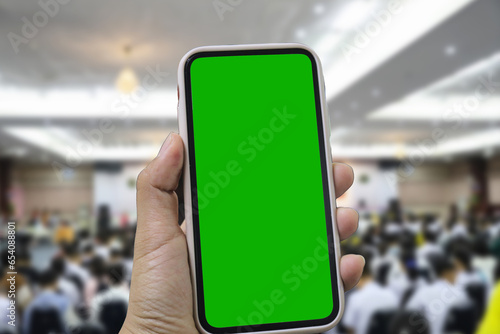 Point of View of Woman at Phone with Green Screen for Copy Space. The concept of a successful business woman, feminism. Close-up.