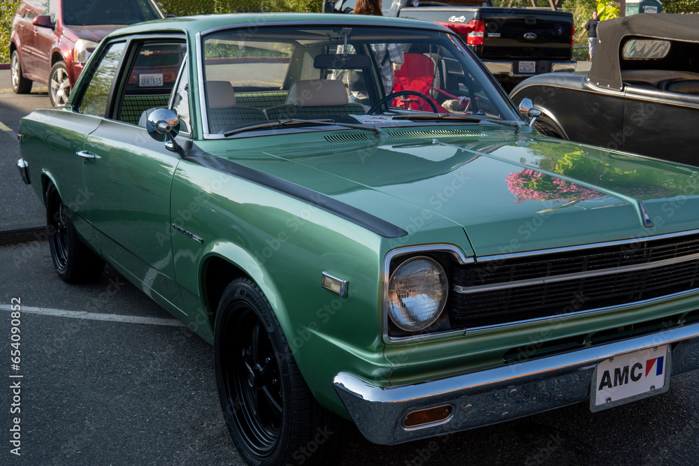 Snohomish, WA, USA 25 September 2022. Headlight of green 1966 AMC